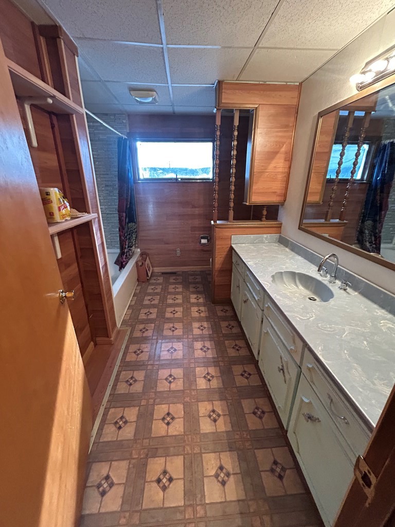 939 Watson Road Titusville, PA 16354 - Photo 15 of 39 a bathroom with double vanity and a mirror