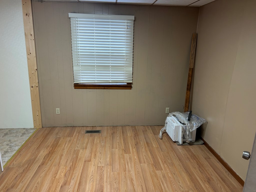 939 Watson Road Titusville, PA 16354 - Photo 17 of 39 a view of a room with wooden floor and a window
