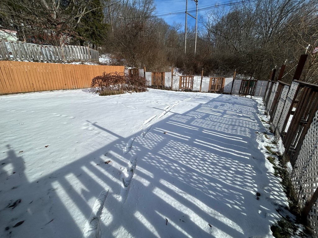 939 Watson Road Titusville, PA 16354 - Photo 35 of 39 a view of backyard with a garden and trees