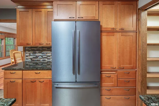 a view of a kitchen with appliances and cabinets