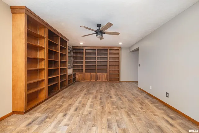 a view of an empty room and a window