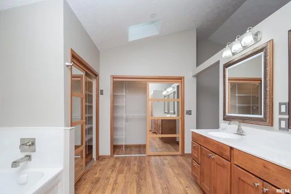 a bathroom with a bathtub and a shower