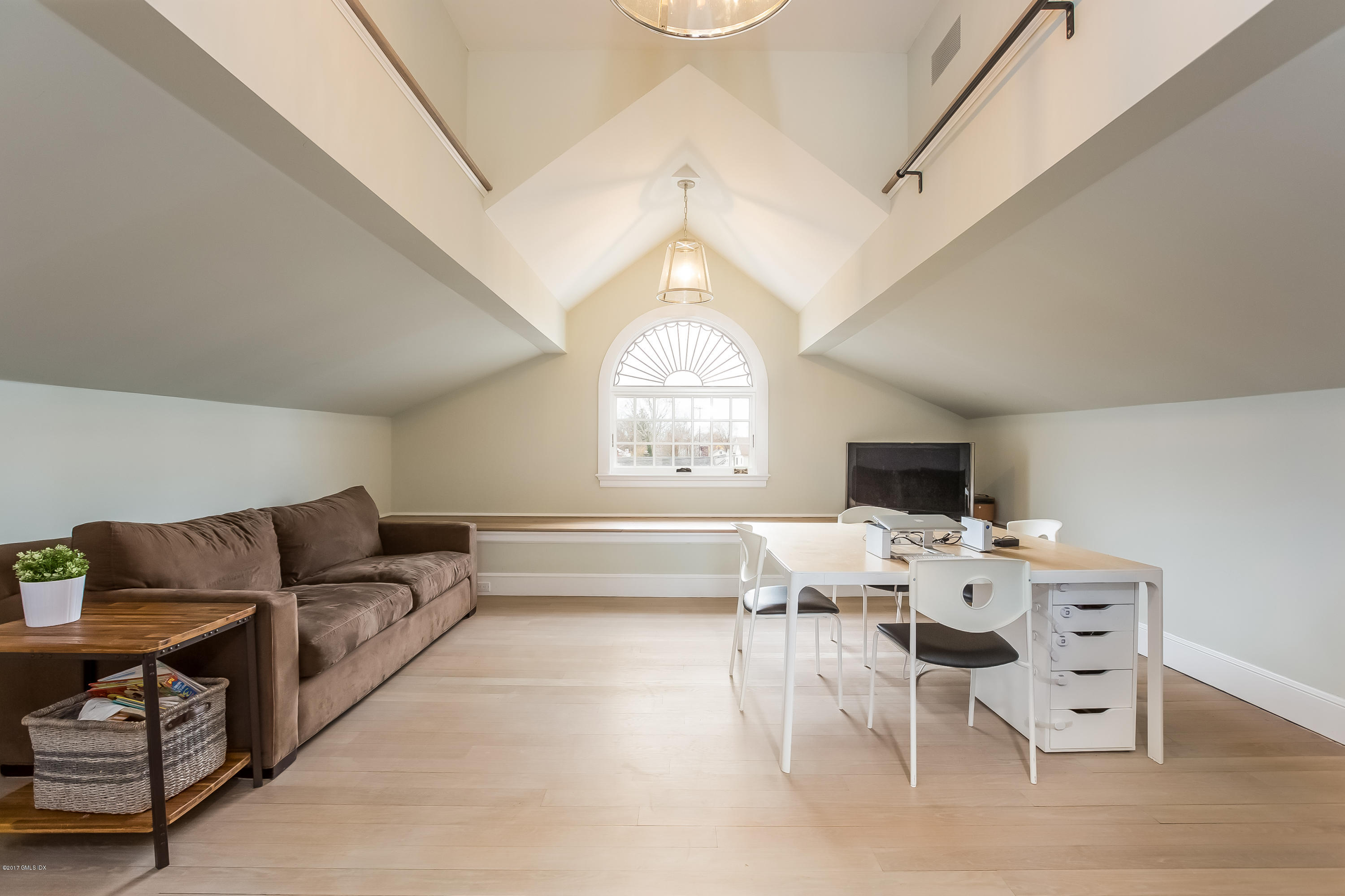 39 Edgewater Drive Old Greenwich, CT 06870 - Photo 14 of 19 a living room with furniture a large window and a chandelier
