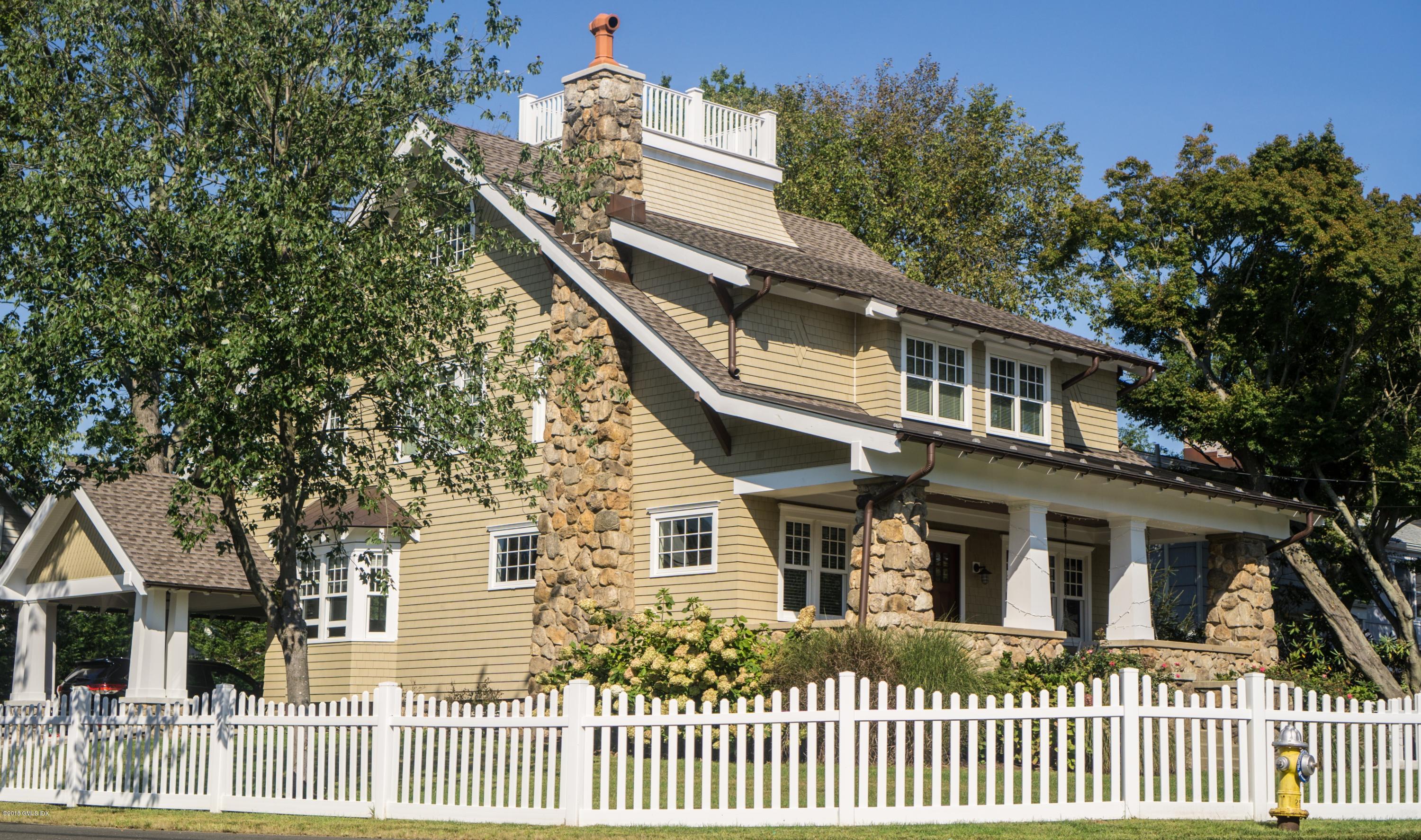 39 Edgewater Drive Old Greenwich, CT 06870 - Photo 16 of 19 a front view of a house with a yard