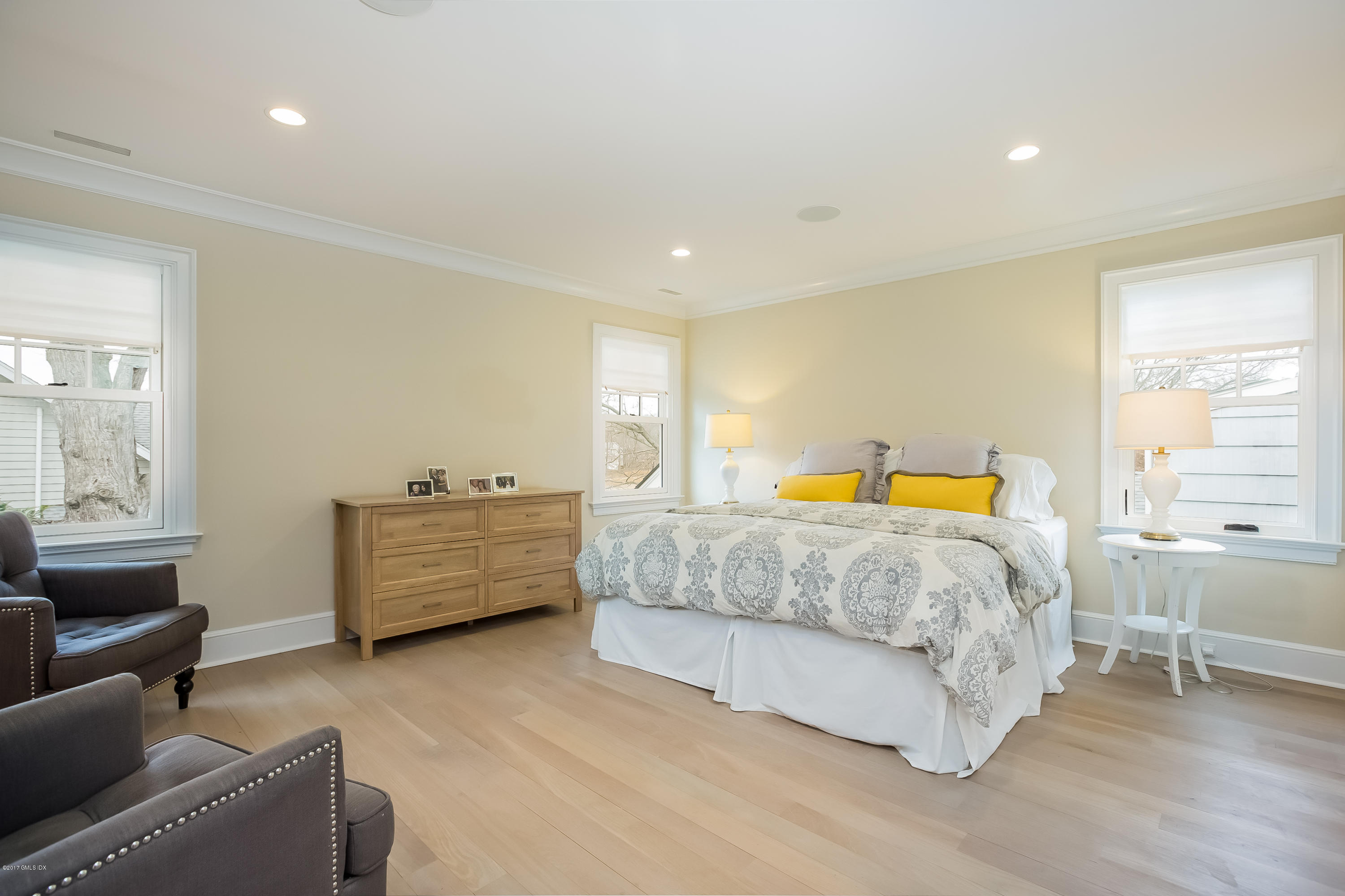 39 Edgewater Drive Old Greenwich, CT 06870 - Photo 7 of 19 a bedroom with a bed and a couch