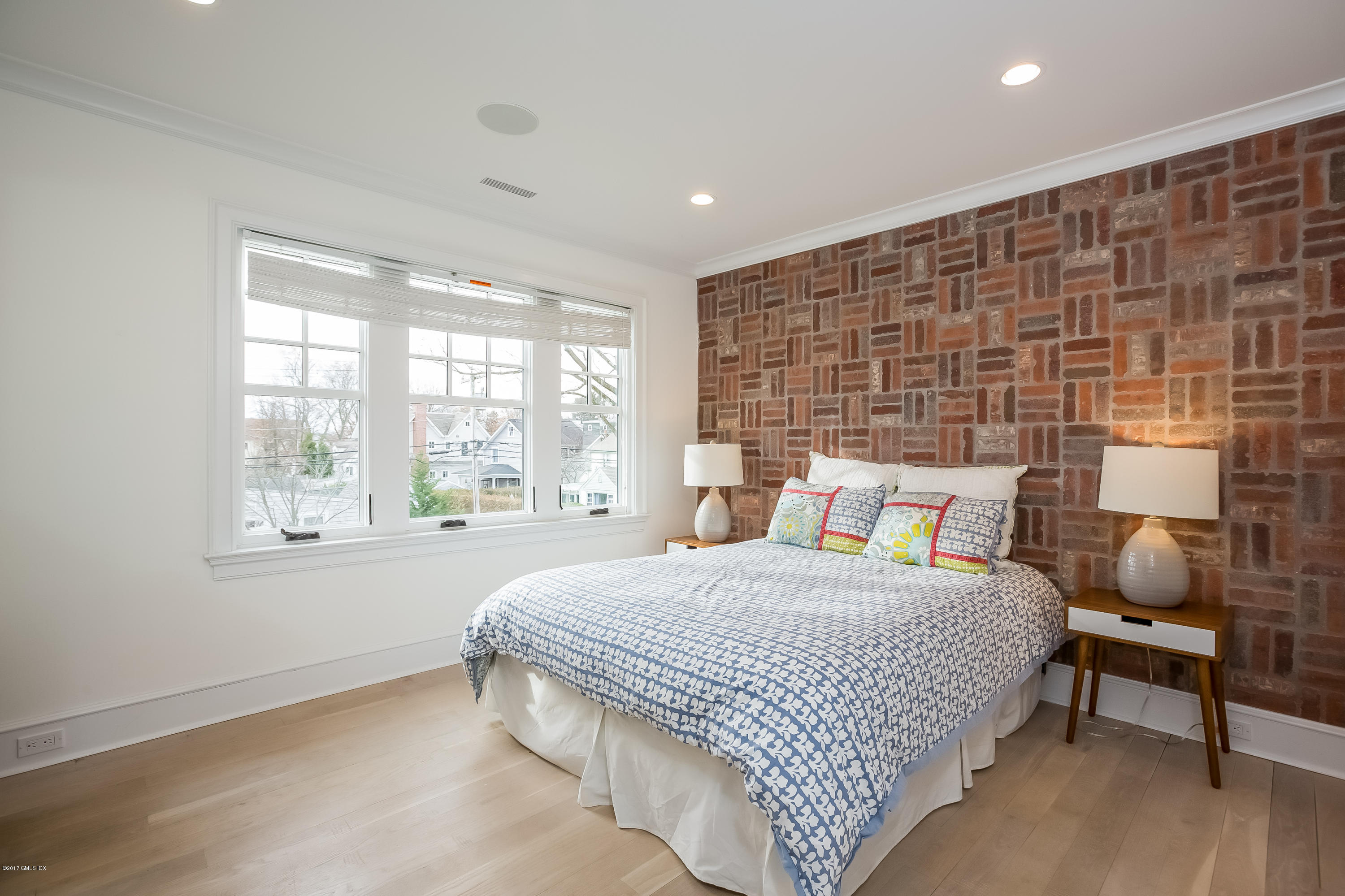 39 Edgewater Drive Old Greenwich, CT 06870 - Photo 10 of 19 a bedroom with a bed and window