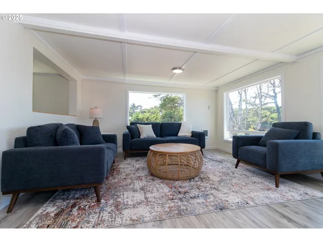 a living room with furniture and a large window