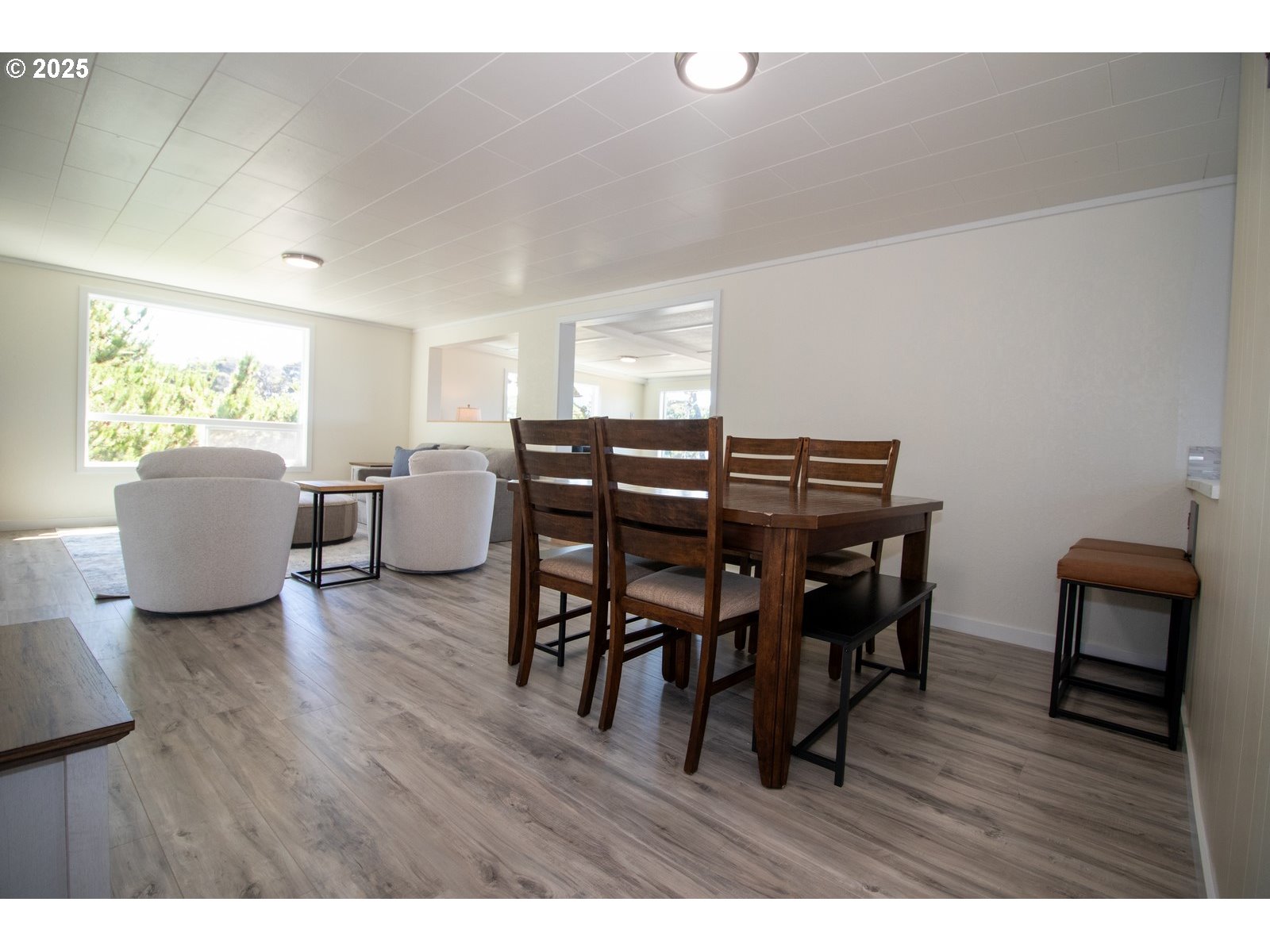 4589 Meares Street Florence, OR 97439 - Photo 19 of 35 a view of a dining room with furniture and wooden floor