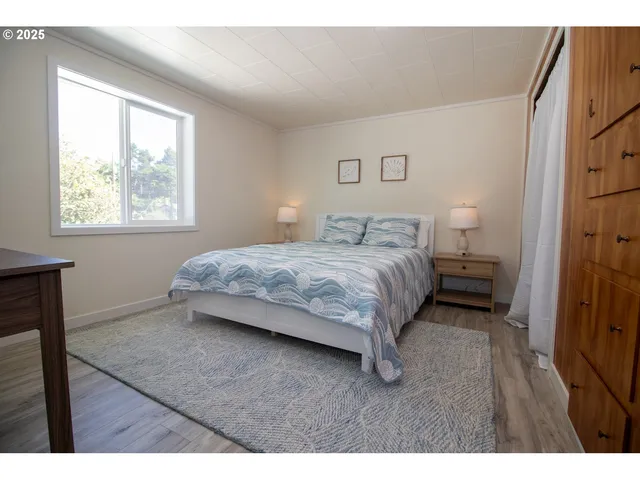 a bedroom with a bed and a table