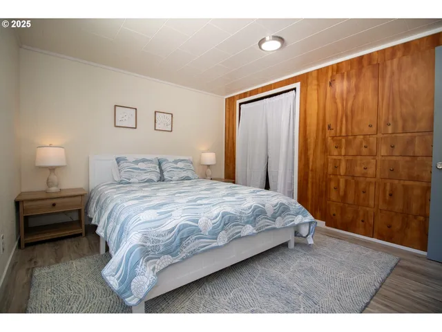 a view of hallway with wooden floor