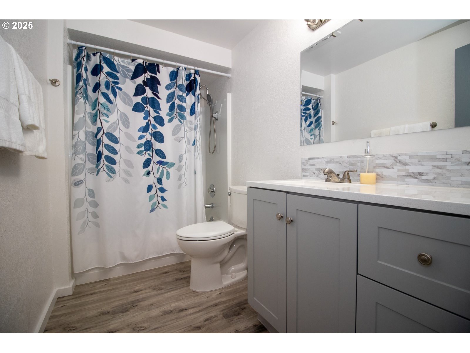 4589 Meares Street Florence, OR 97439 - Photo 26 of 35 a bathroom with a toilet sink and shower