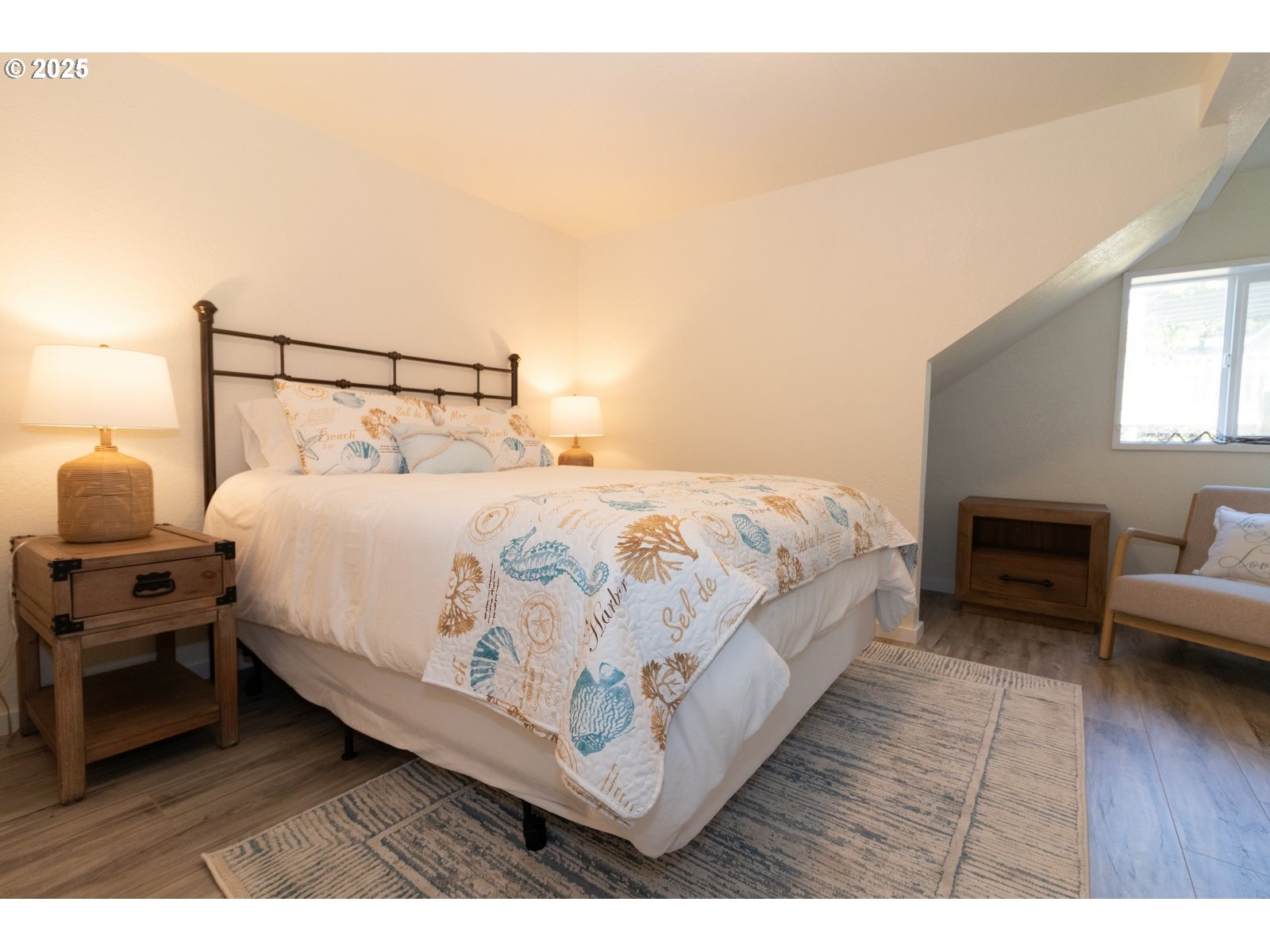 4589 Meares Street Florence, OR 97439 - Photo 31 of 35 a large white bed sitting in a bedroom next to a window