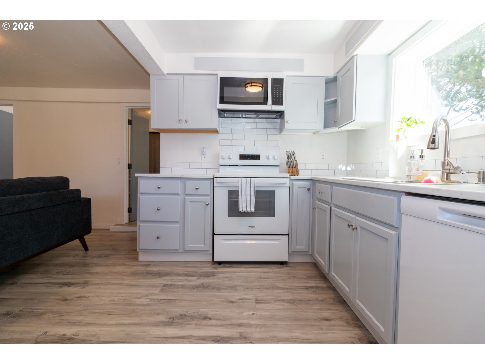 4589 Meares Street Florence, OR 97439 - Photo 33 of 35 a kitchen with stainless steel appliances granite countertop a stove top oven a sink dishwasher and granite countertops with cabinets