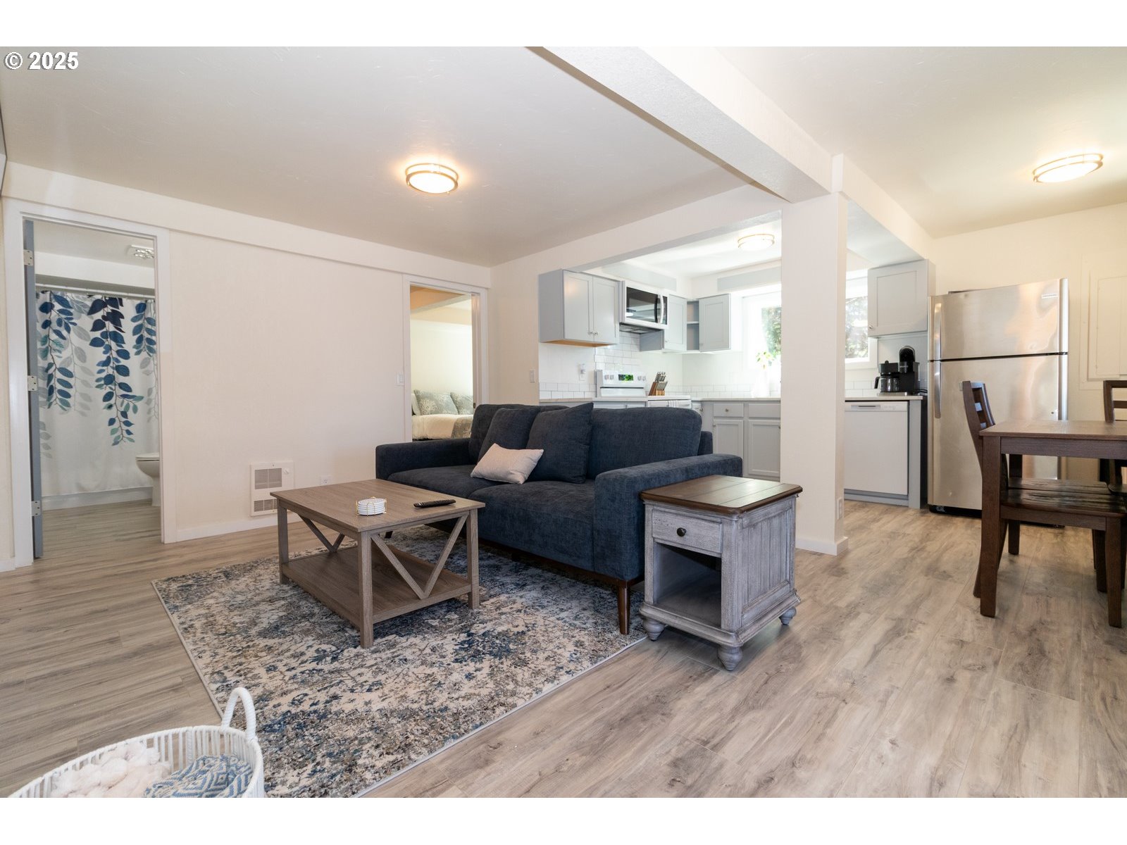 4589 Meares Street Florence, OR 97439 - Photo 35 of 35 a living room with furniture a wooden floor and a fireplace