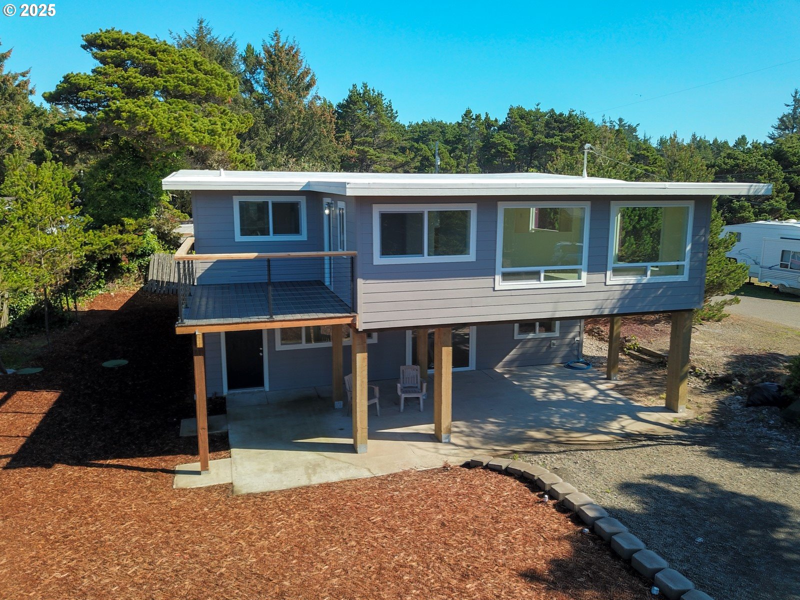 4589 Meares Street Florence, OR 97439 - Photo 4 of 35 a front view of a house with a porch