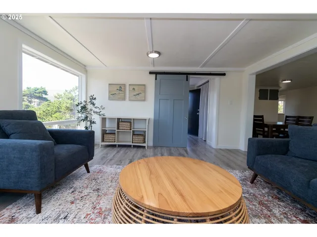 a living room with furniture and a table