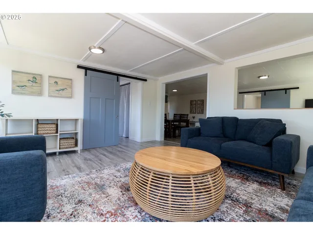 a living room with furniture a window and a couch