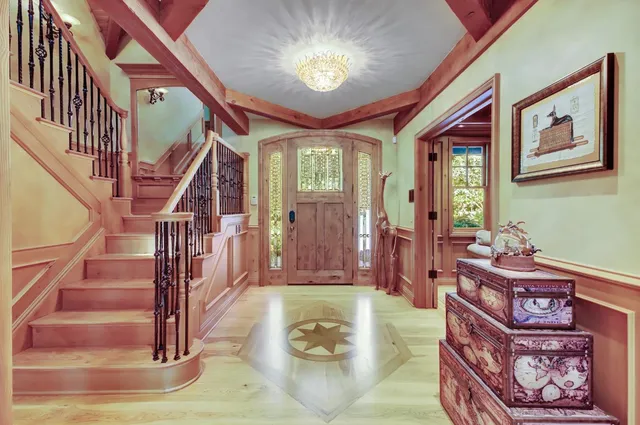 a view of a kitchen with a sink and a refrigerator