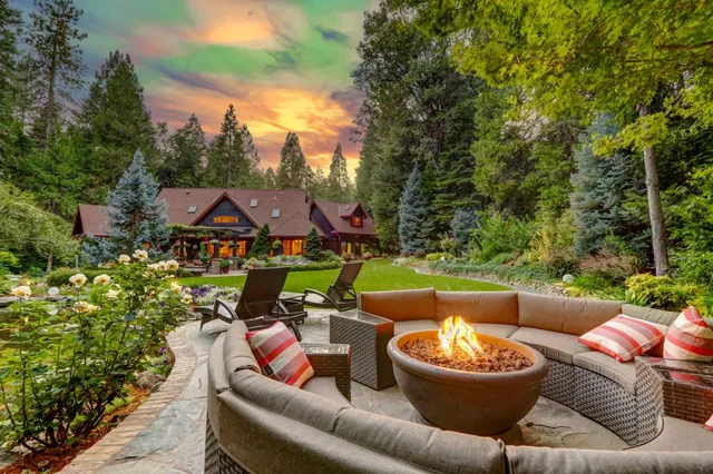 a view of a patio with couches and a fire pit