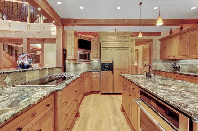 a view of a garden with large trees