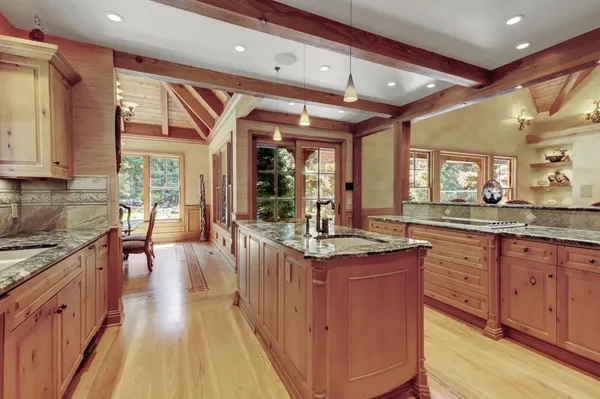 a room with lots of furniture and a chandelier