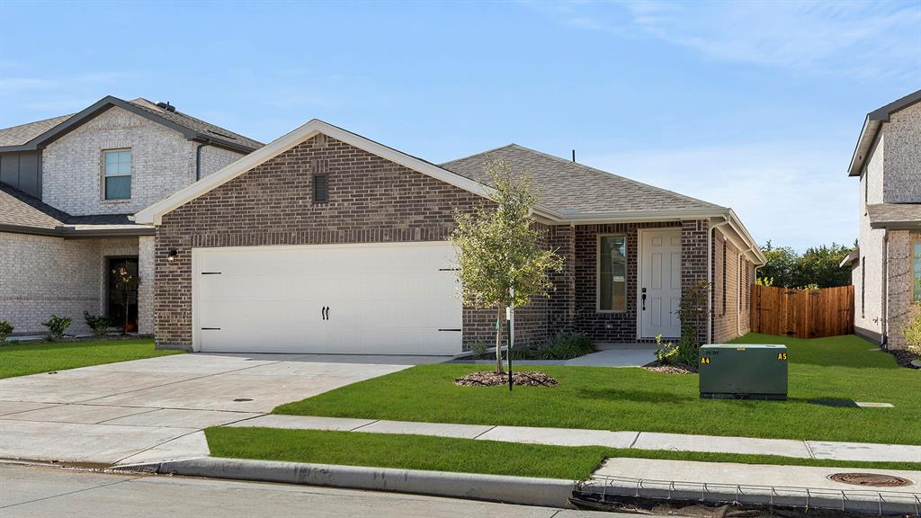 2516 YO Rnch Road Anna, TX 75409 - Photo 2 of 30 a front view of a house with a yard and garage