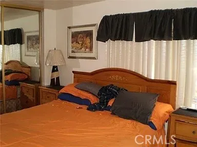 a bedroom with a bed and walk in closet