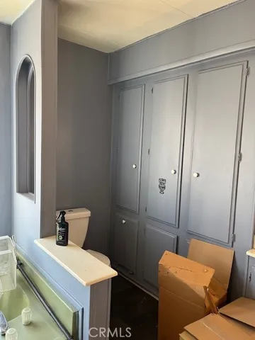 a bedroom with a bed and a chair