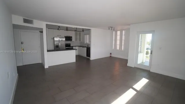 a view of a kitchen and window