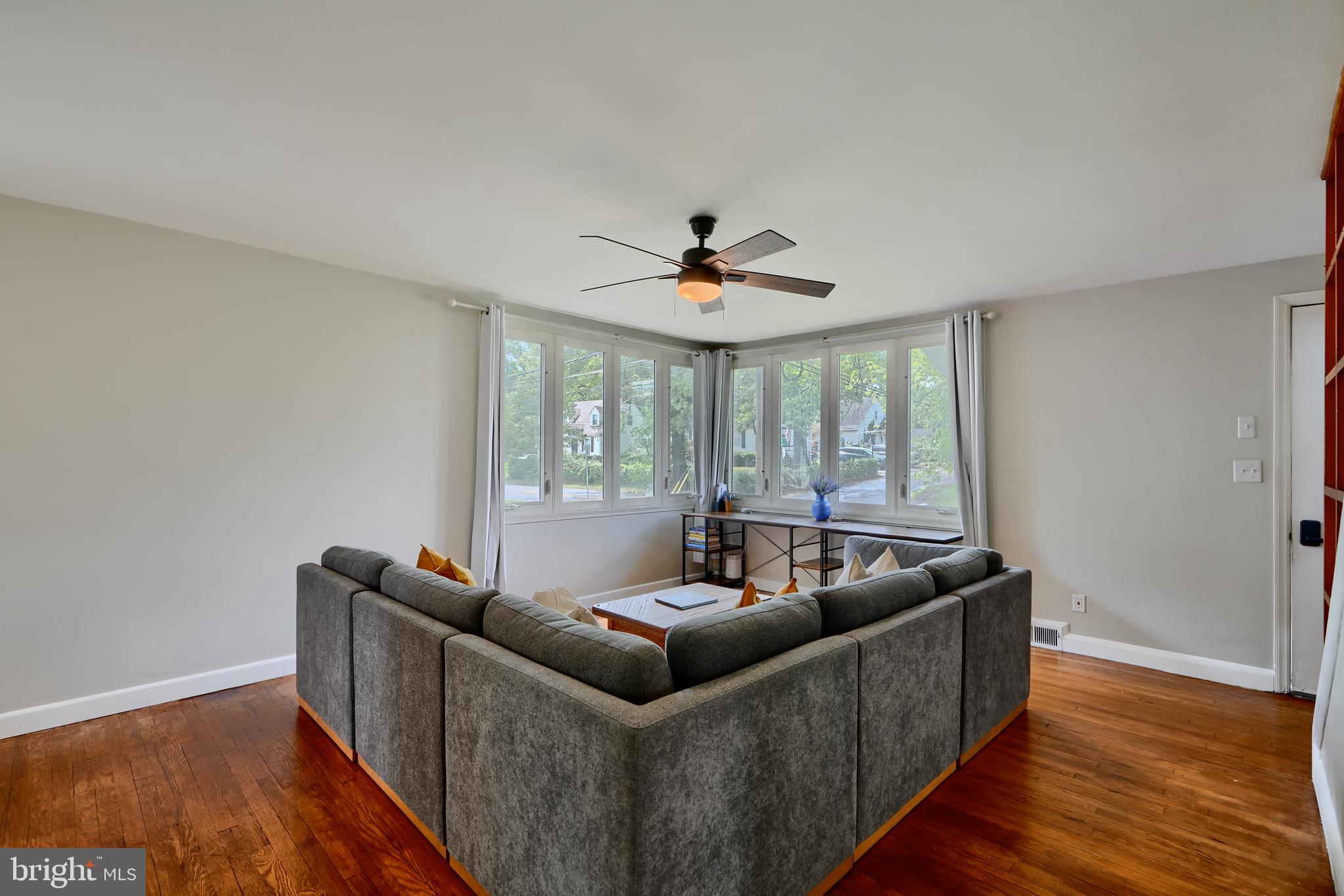 8203 Oakleigh Road Baltimore, MD 21234 - Photo 11 of 56 a living room with furniture and a large window