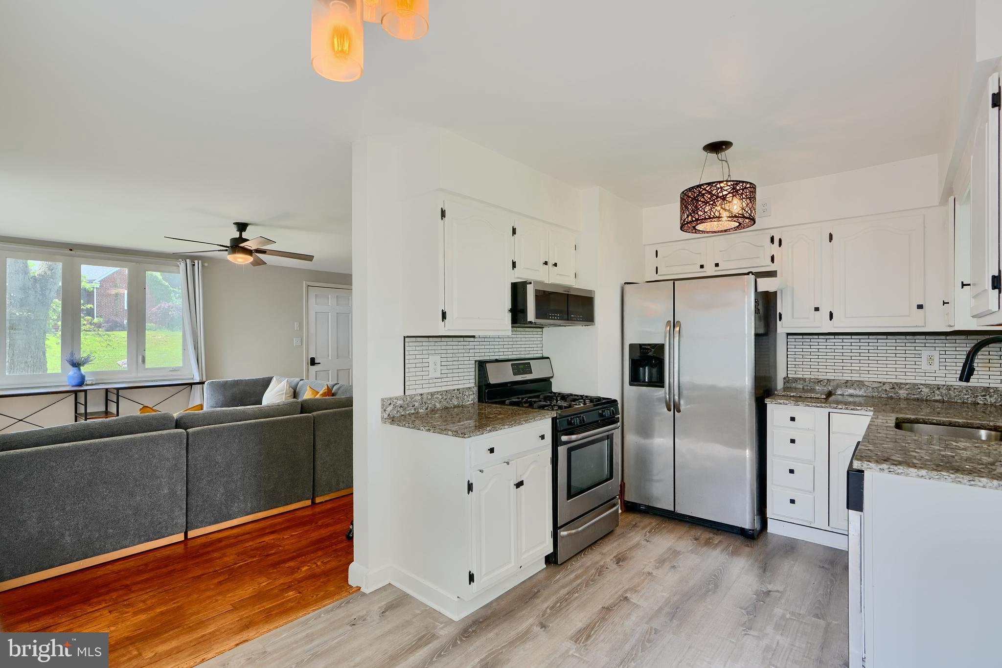 8203 Oakleigh Road Baltimore, MD 21234 - Photo 15 of 56 a kitchen with stainless steel appliances a stove refrigerator sink and microwave
