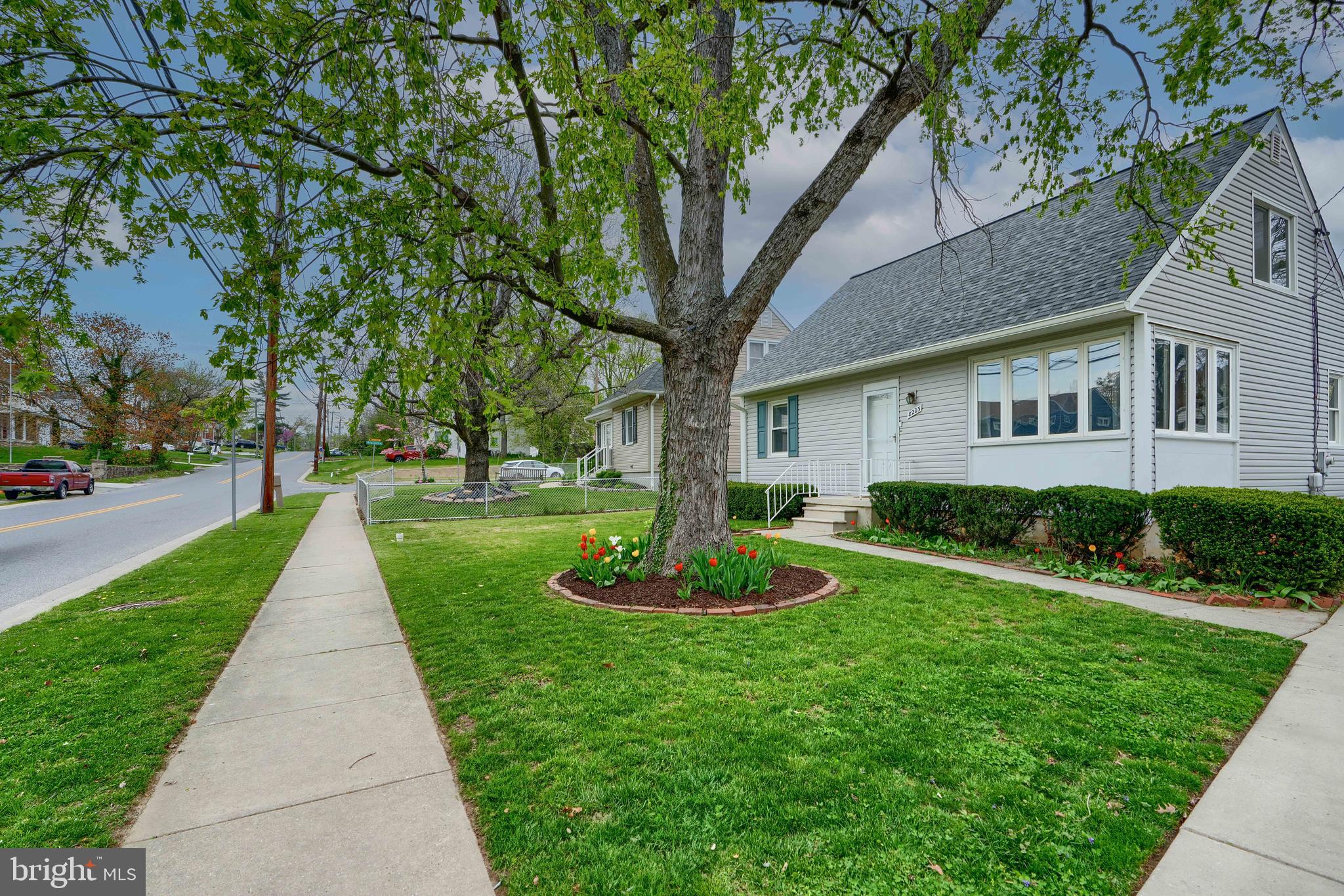 8203 Oakleigh Road Baltimore, MD 21234 - Photo 2 of 56 a view of a yard in front of house