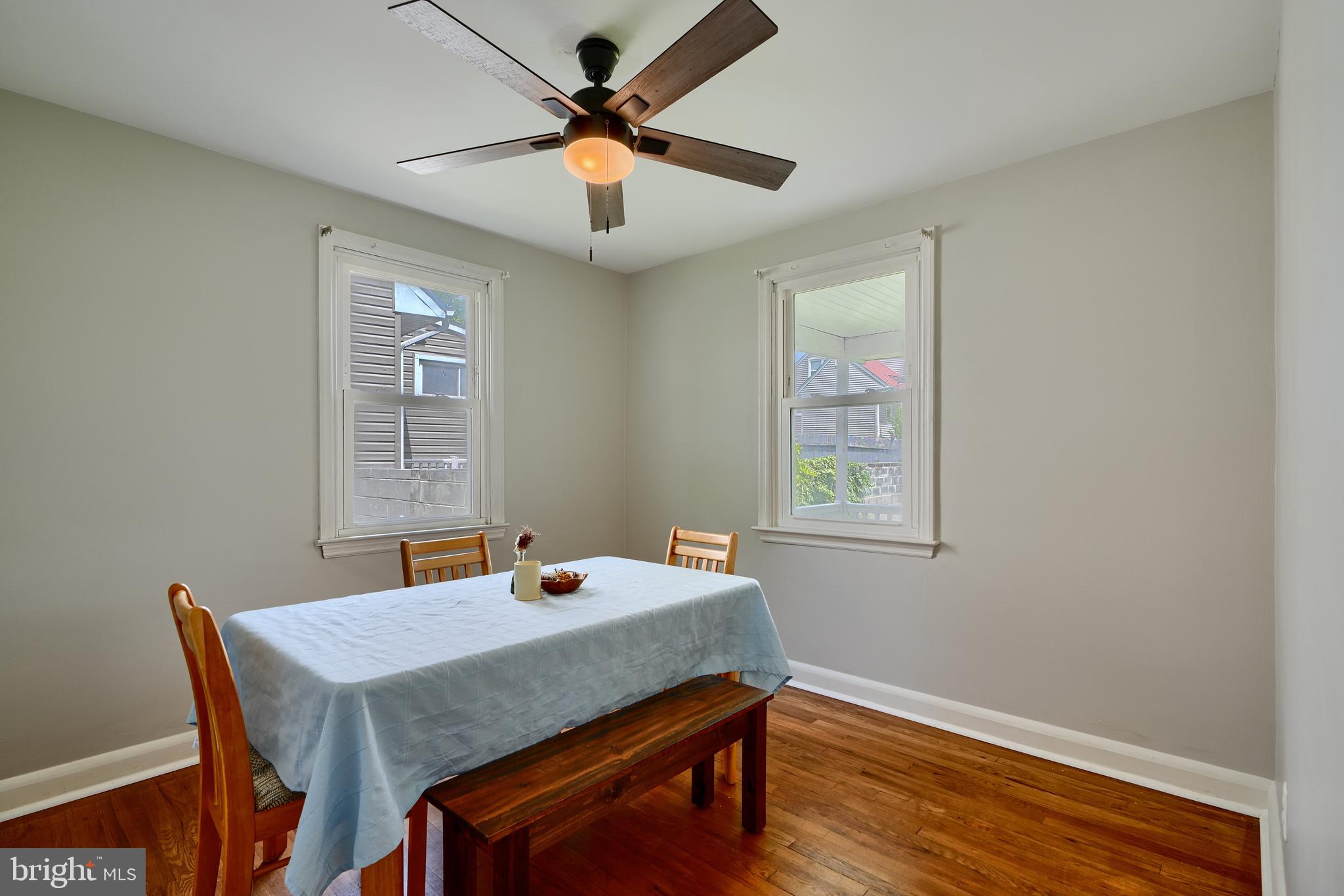8203 Oakleigh Road Baltimore, MD 21234 - Photo 22 of 56 a view of a dining room with a table and chairs