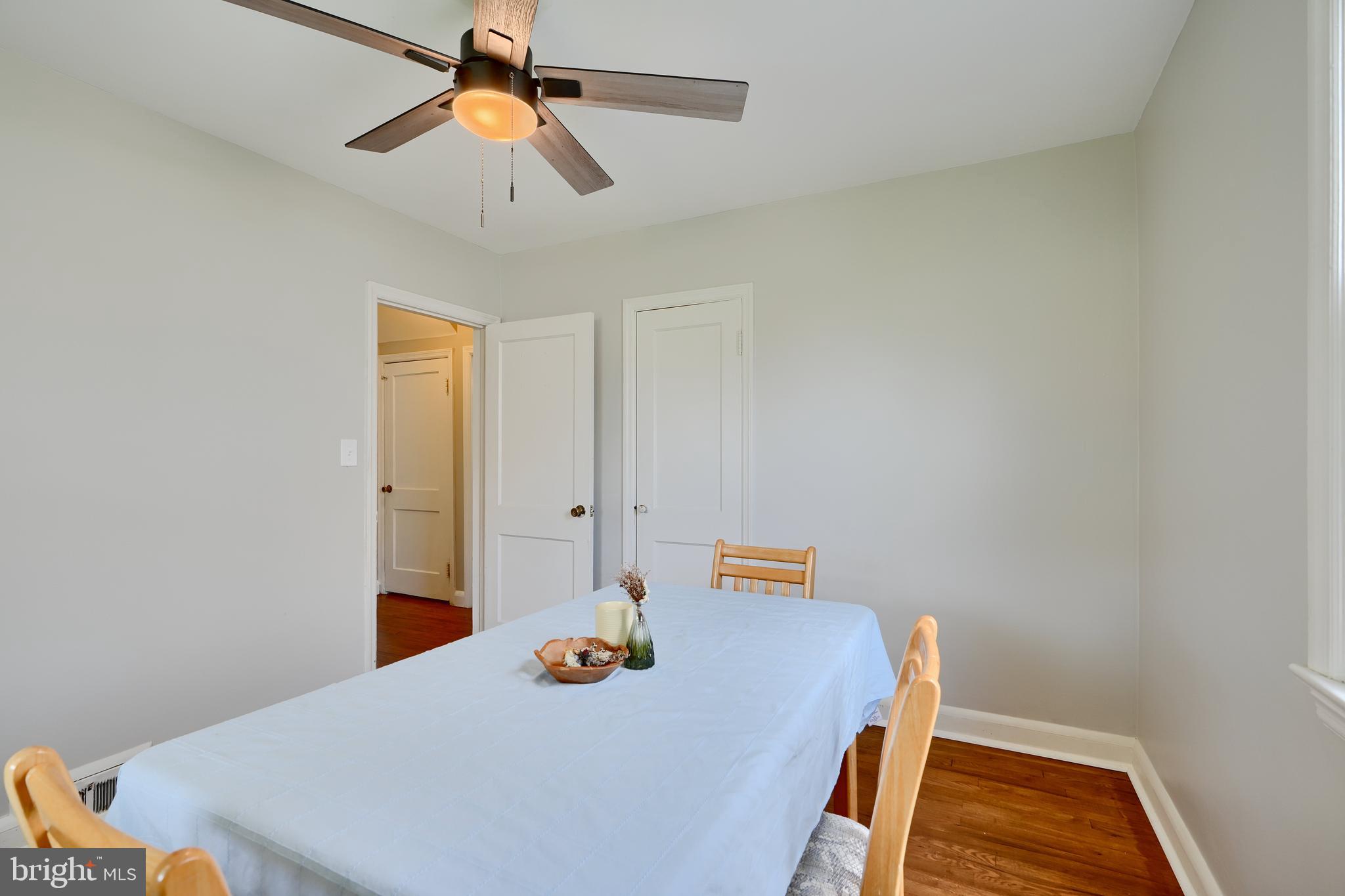 8203 Oakleigh Road Baltimore, MD 21234 - Photo 24 of 56 a view of a workspace with furniture and wooden floor