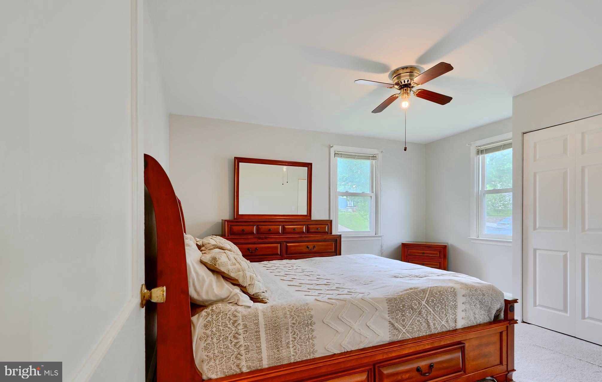 8203 Oakleigh Road Baltimore, MD 21234 - Photo 25 of 56 a bedroom with a bed and ceiling fan