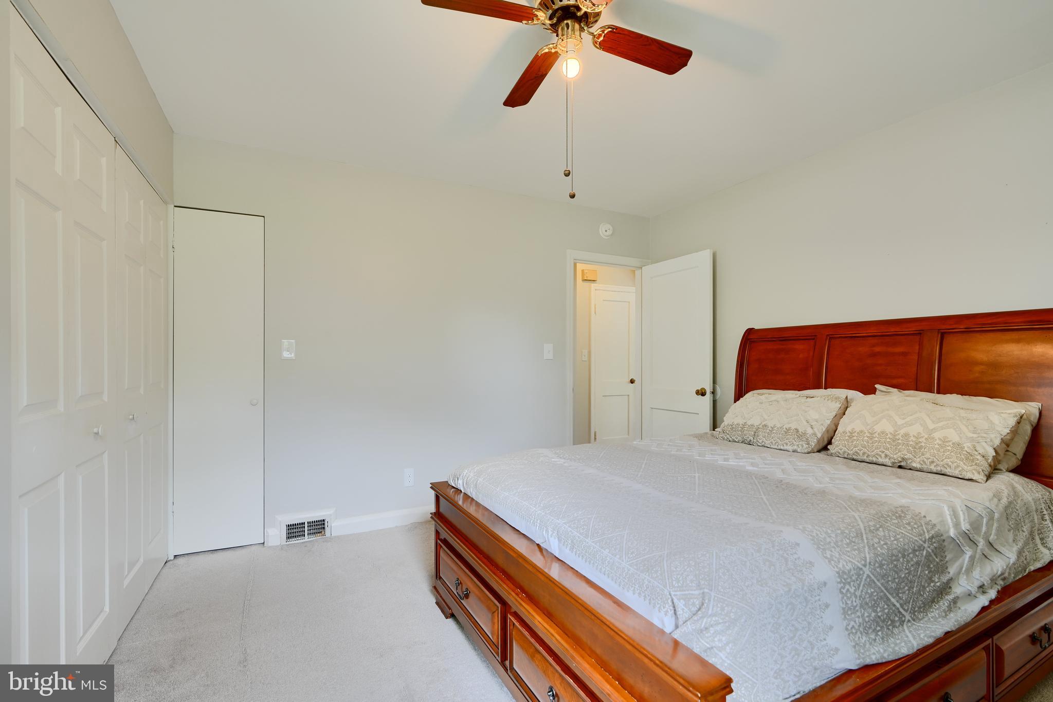 8203 Oakleigh Road Baltimore, MD 21234 - Photo 27 of 56 a bedroom with a bed and closet
