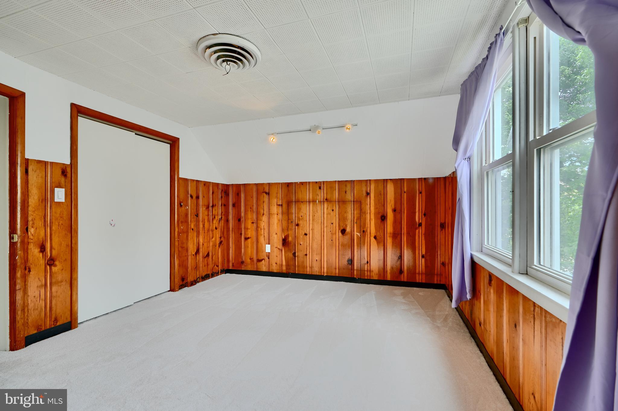 8203 Oakleigh Road Baltimore, MD 21234 - Photo 34 of 56 a view of an empty room with a window
