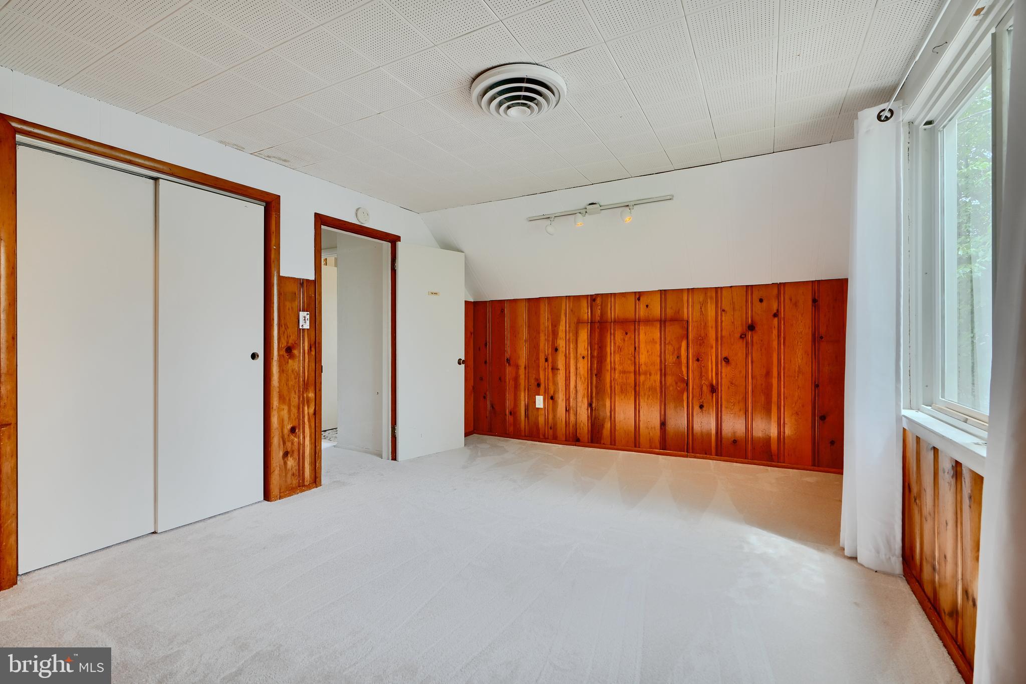 8203 Oakleigh Road Baltimore, MD 21234 - Photo 36 of 56 a view of an empty room with wooden floor