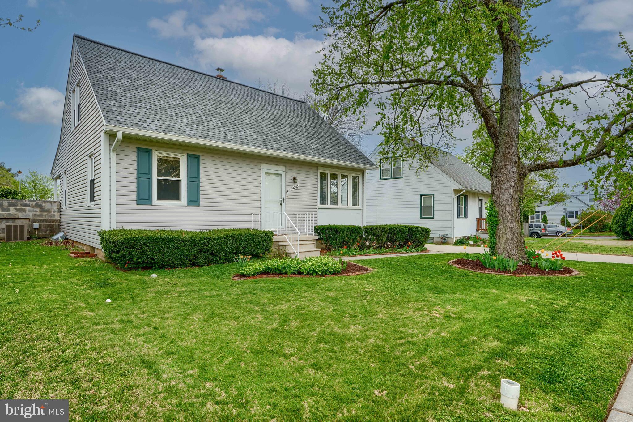 8203 Oakleigh Road Baltimore, MD 21234 - Photo 5 of 56 a front view of house with yard and green space