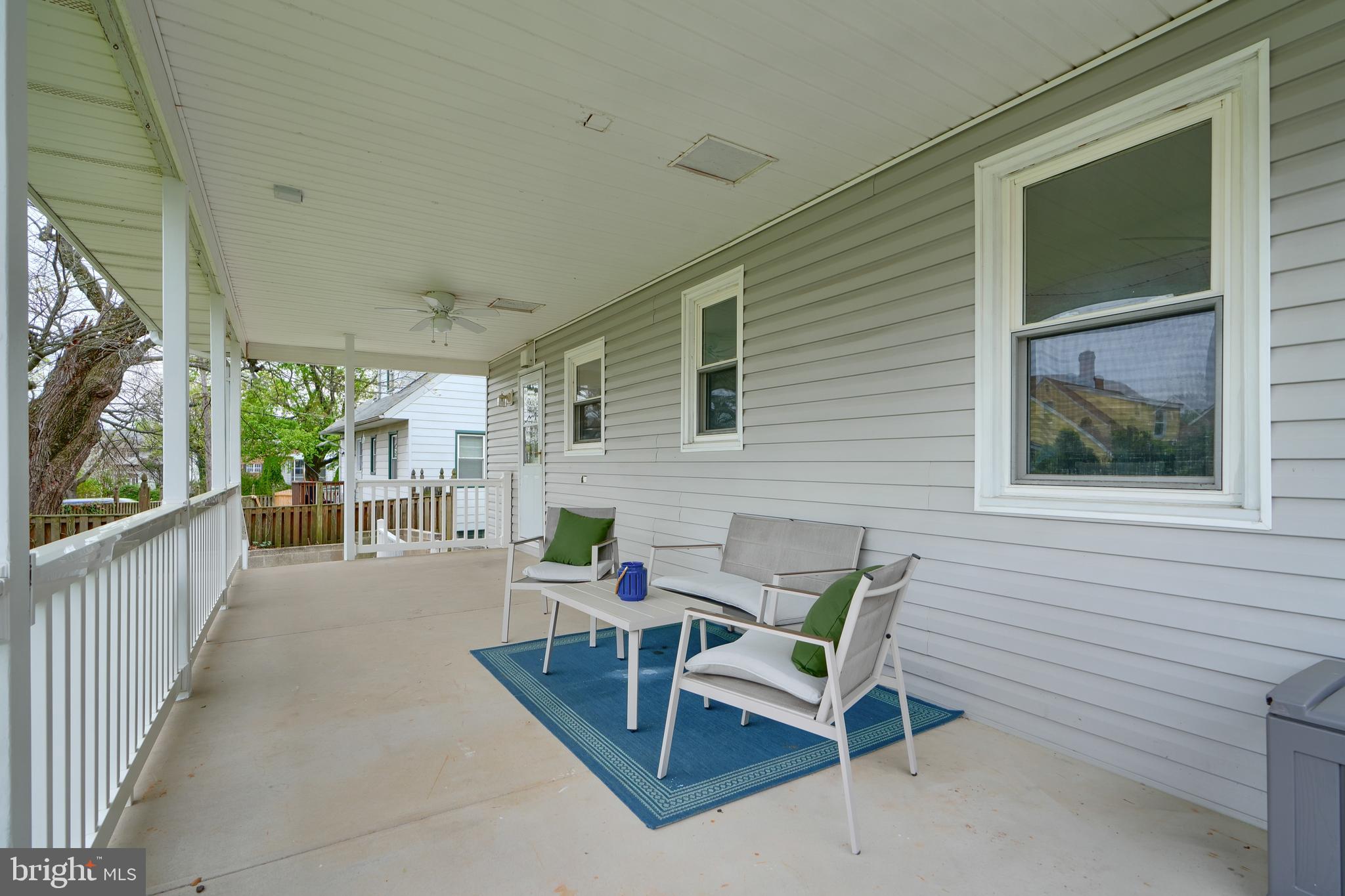 8203 Oakleigh Road Baltimore, MD 21234 - Photo 53 of 56 a view of a patio with a chairs and table in a balcony