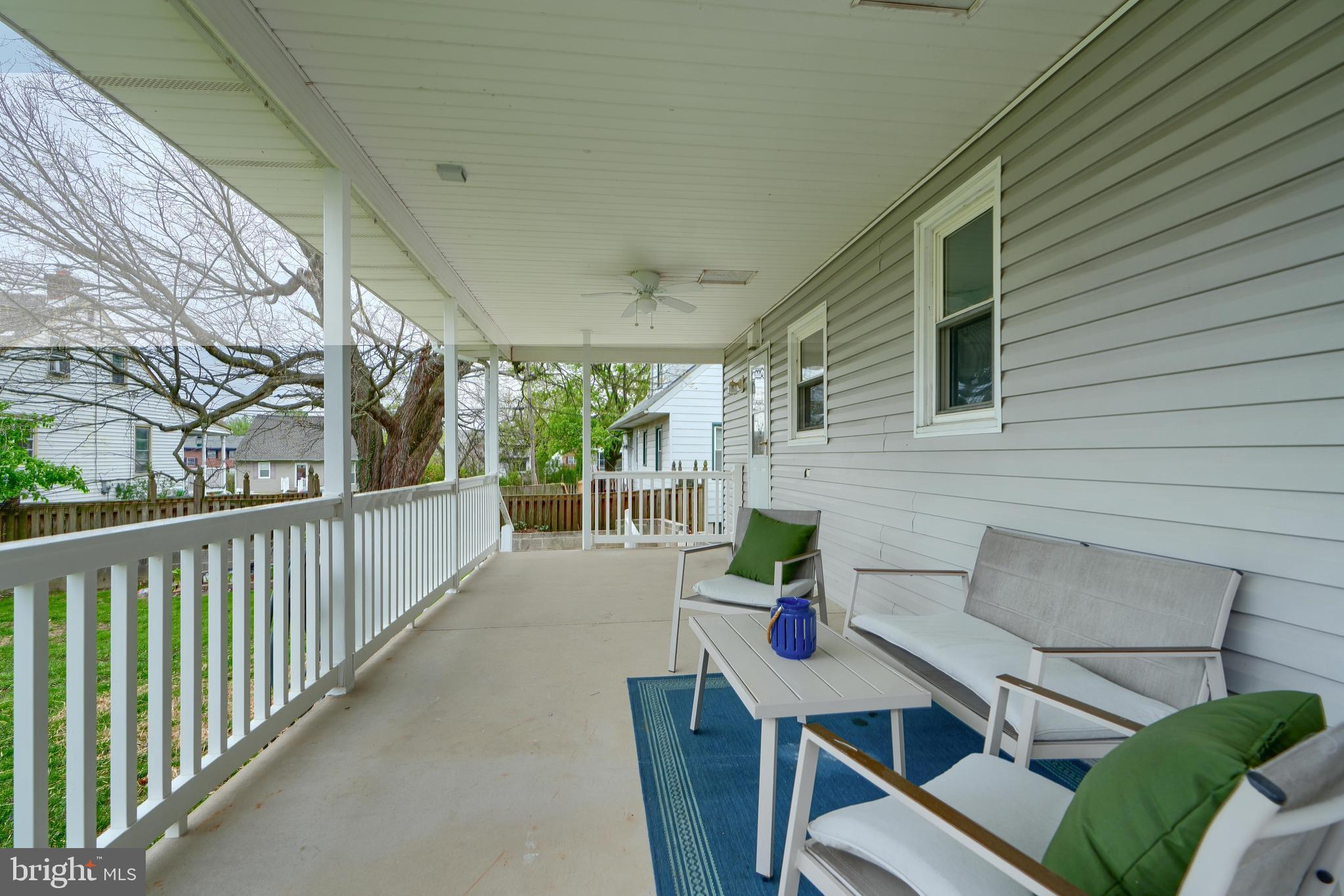 8203 Oakleigh Road Baltimore, MD 21234 - Photo 54 of 56 a view of a patio with couches table and chairs and potted plants