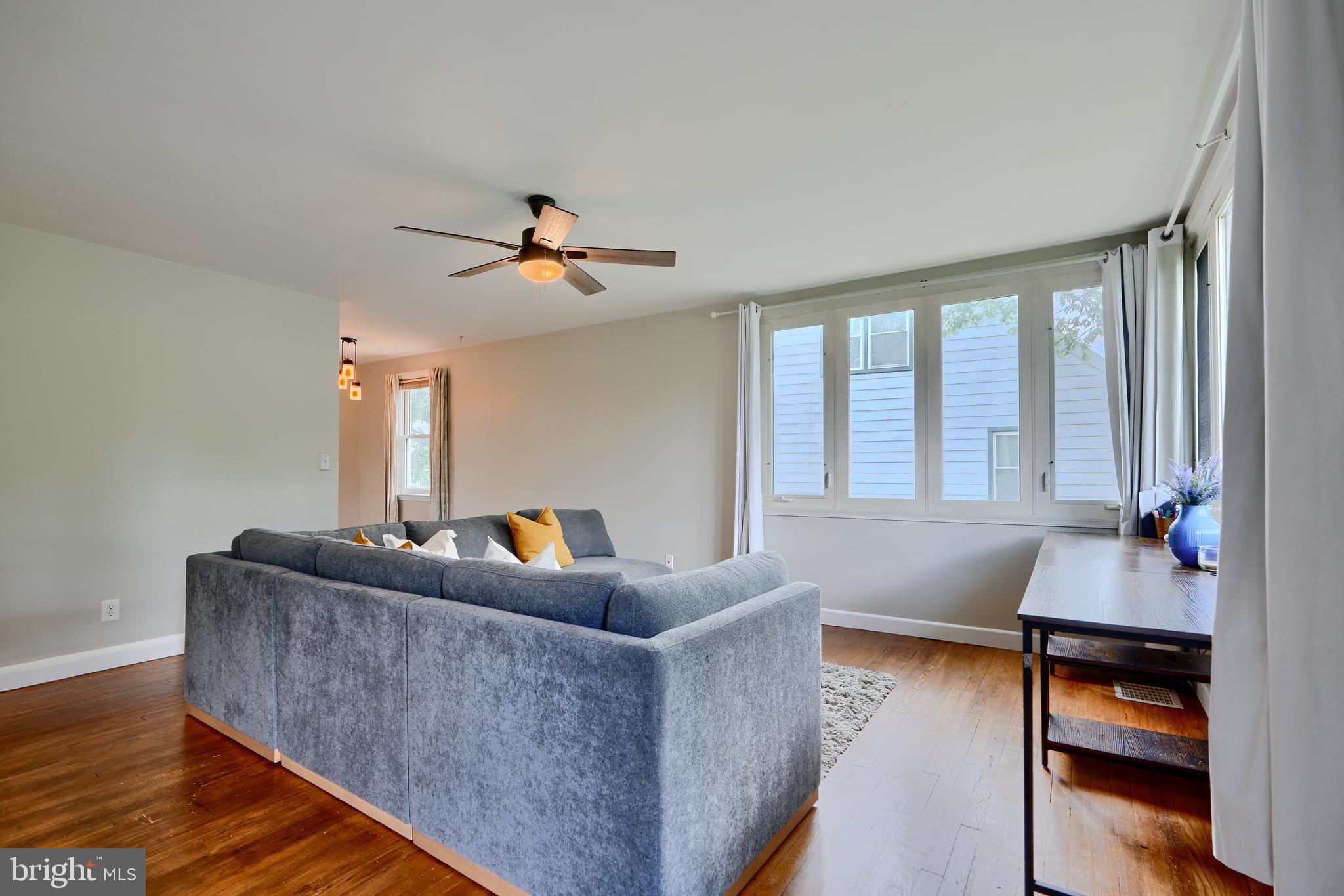8203 Oakleigh Road Baltimore, MD 21234 - Photo 6 of 56 a living room with furniture and a large window