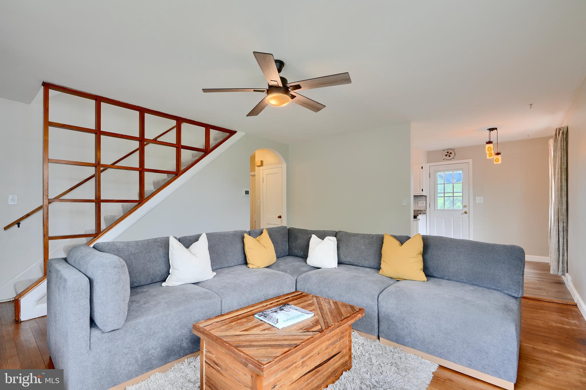 8203 Oakleigh Road Baltimore, MD 21234 - Photo 7 of 56 a living room with furniture and a wooden floor