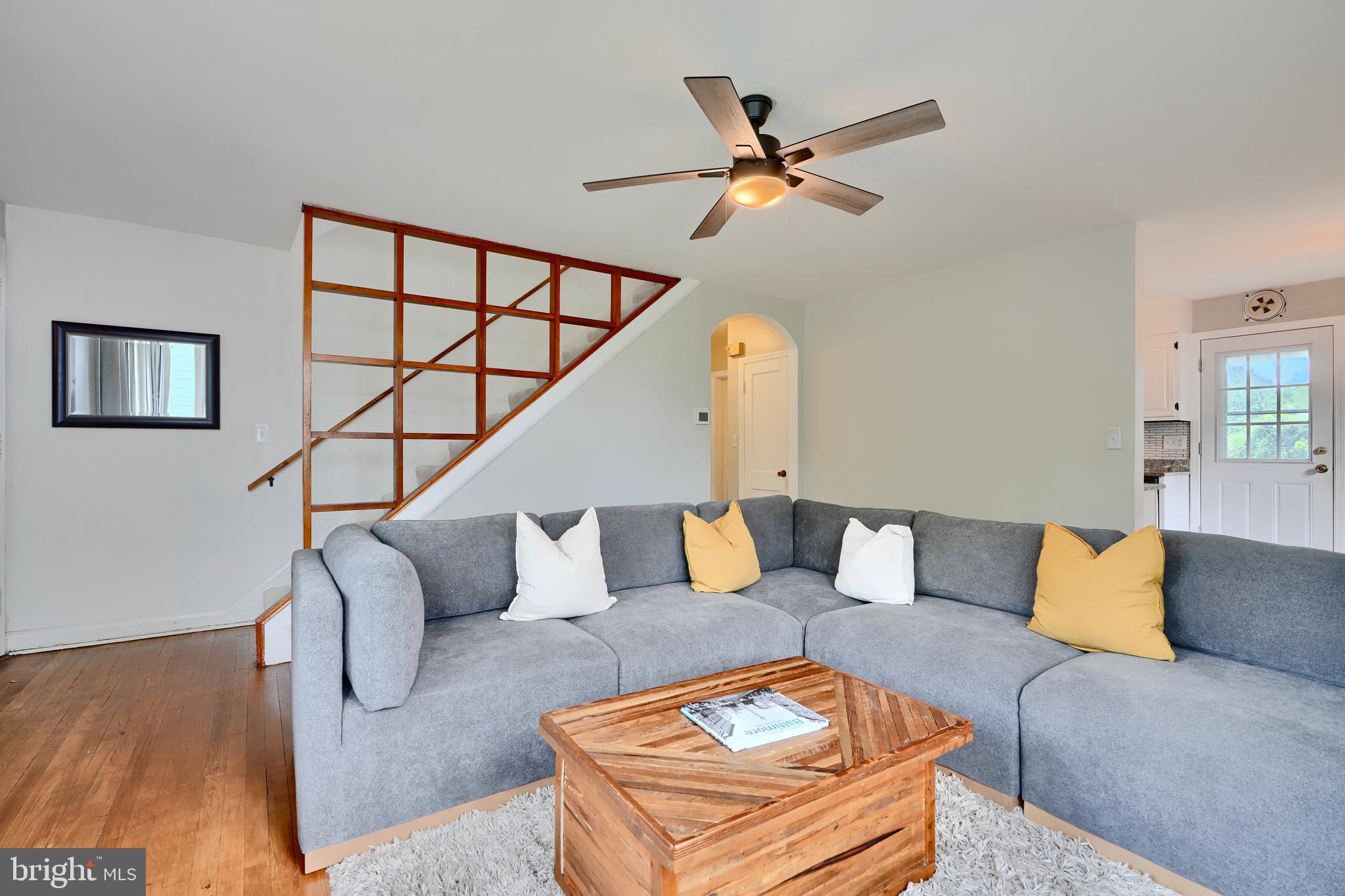 8203 Oakleigh Road Baltimore, MD 21234 - Photo 8 of 56 a living room with furniture and a wooden floor