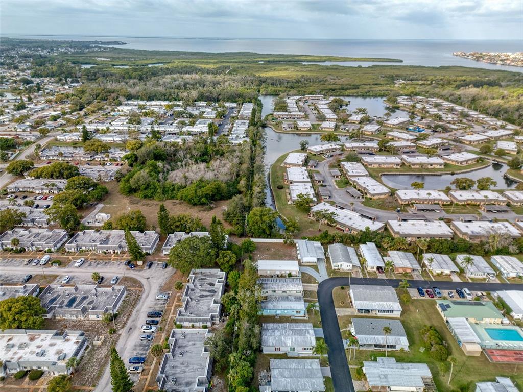 4242 Redcliff Place, Unit C New Port Richey, FL 34652 - Photo 15 of 15 an aerial view of residential building and lake view