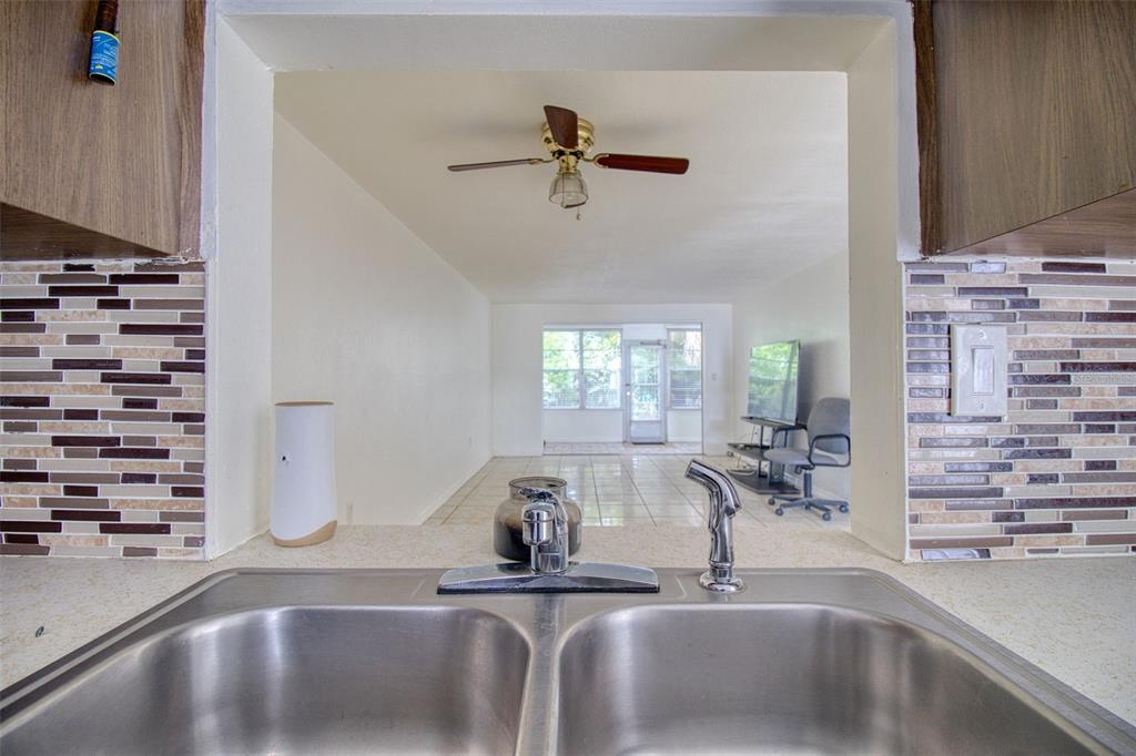 4242 Redcliff Place, Unit C New Port Richey, FL 34652 - Photo 5 of 15 a kitchen with a sink and a potted plant