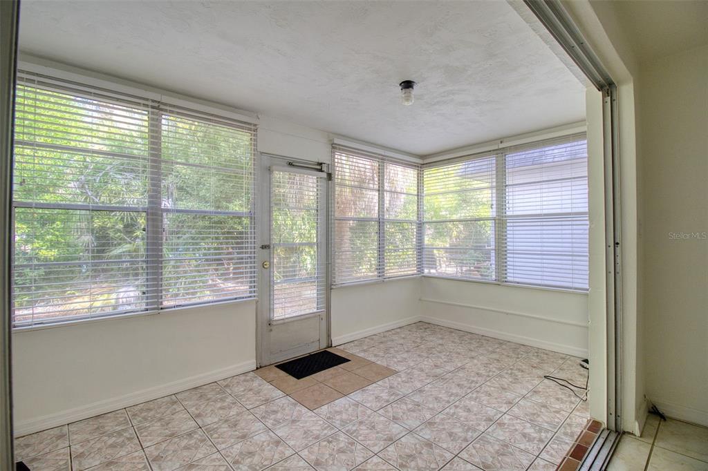 4242 Redcliff Place, Unit C New Port Richey, FL 34652 - Photo 7 of 15 a view of an empty room with a window