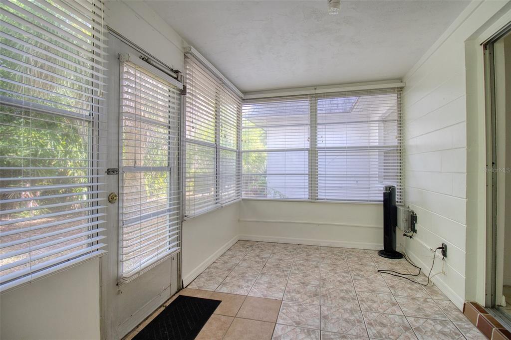 4242 Redcliff Place, Unit C New Port Richey, FL 34652 - Photo 8 of 15 a bathroom with a bathtub and a shower