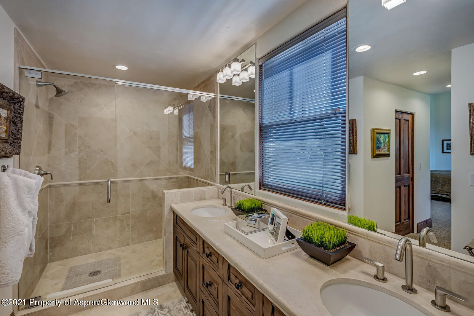 245 Saddleback Road Carbondale, CO 81623 - Photo 12 of 19 a bathroom with a granite countertop sink a mirror and shower
