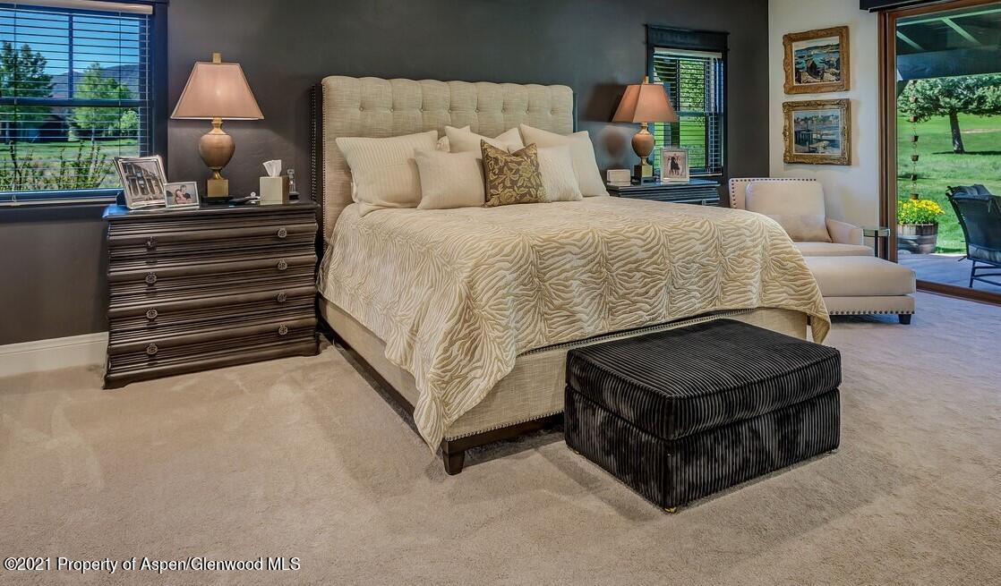 245 Saddleback Road Carbondale, CO 81623 - Photo 10 of 19 a bed sitting in a bedroom next to a window